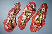 Raw beef roulades with pancetta, grilled aubergines and tomatoes