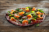 Beetroot pizza with leek, broccolini and baby spinach