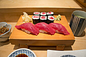 Nigiri and maki sushi with tuna, wasabi and ginger