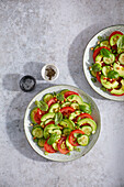 Tomato and avocado salad with pine nuts