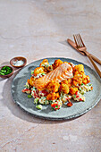Oven-baked salmon with roasted cauliflower and couscous