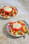 Stuffed peppers with feta cheese cream on gnocchi salad