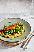 Carrot omelet with peas and spinach