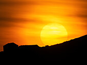 Setting Sun over a barn