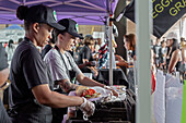 Workers preparing food at vegan food festival