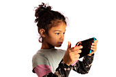 Girl playing with a games console