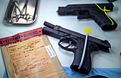 Handguns and evidence bag