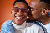 Happy young gay male couple