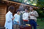 Gay couples enjoying barbecue