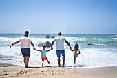 Family splashing in ocean