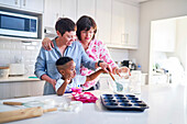 Family baking cupcakes