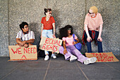 Young friends with equal rights signs