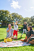 Parents watching son with Down syndrome playing with bubbles