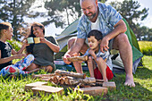 Father and son with Down syndrome stacking firewood