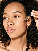 Woman using serum