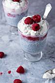 Chia pudding with whipped cream, raspberries and honey