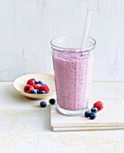 Breakfast shake with oatmeal, berries and soya drink