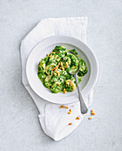 Gnocchi with gorgonzola sauce, spinach and pine nuts