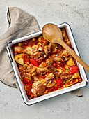 Chicken drumsticks with potatoes and peppers from the oven