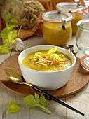Celery soup with turmeric and vegetable straw