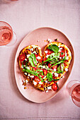 Naan heart with tomatoes, feta and salad mix for Valentine's Day