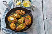 Hasselback potatoes with lemon sauce