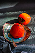 Persimmon fruit in a bowl