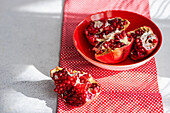 Pieces of pomegranate in a ceramic bowl