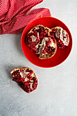 Pieces of pomegranate in a ceramic bowl