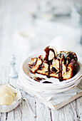 Giant skillet chocolate and cinnamon spiral with chocolate sauce and vanilla ice-cream