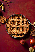 Rustic apple tart with cinnamon in a pastry lattice