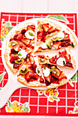 Sweet pizza with strawberry jam, strawberries and kiwi