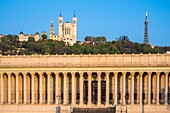 France,Rhone,Lyon,historic district listed as a UNESCO World Heritage site,quai Romain-Rolland,historic courthouse also called Palace of the twenty-four columns (1847) and Notre Dame de Fourviere basilica in the background