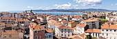 France,Var,Saint-Raphaël,the old center and Notre-Dame de la Victoire basilica,Frejus beach and the Maures massif in the background