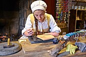France,Vendee,Les Epesses,Le Puy du Fou historical theme park,Medieval city,Art craftswoman,Woodcut