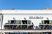 France,Alpes Maritimes,Nice,listed as World Heritage by UNESCO,Vieux Nice district,quai des Etats Unis,customers on the balcony of Wakabar facing the Baie des Anges