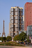France,Paris,Buildings of Front de Seine and Beaugrenelle shopping center by Valode et Pistre architect firm and the Eiffel Tower