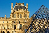 France,Paris,area listed as World Heritage by UNESCO,reflection of the facade of the Richelieu Wing on the pyramid of the Louvre by the architect Ieoh Ming Pei in the Cour Napoleon