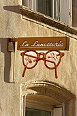 France,Meurthe et Moselle,Nancy,detail of the sign of an optician in the old town in Grande Rue (Grande street)
