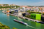 France,Rhône (69),Lyon,district of La Confluence in the south of the peninsula,first French quarter certified sustainable by the WWF,view of the quai Rambaud along the old docks with the Green Cube and Orange Cube and Notre Dame de Fourviere Basilica