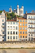 France,Rhone,Lyon,historic district listed as a UNESCO World Heritage site,Old Lyon,Quai Fulchiron on the banks of the Saone river,Notre-Dame de Fourviere basilica in the background