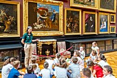 France,Oise,Chantilly,the castle of Chantilly,the museum of Conde,the gallery of paintings,explanation by the staff to a class of children
