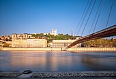 France,Rhone,Lyon,historic district listed as a UNESCO World Heritage site,banks of the Saone river,courthouse footbridge and Notre-Dame de Fourviere basilica in the background