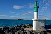 France,Herault,Agde,Cape of Agde,La Digue Lighthouse with Fort Brescou in the background