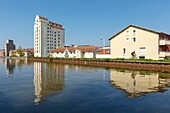 France,Meurthe et Moselle,Nancy,former grain silos (1941-1942) now apartment buildings on the Meurthe canal