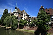 France,Bas Rhin,Strasbourg,district of Neustadt dating from the German period listed as a UNESCO World Heritage Site,the Faux Remparts canal and the Pontonniers high school at 1,rue des Pontonniers