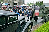 France,Territoire de Belfort,Vézelois,street,church,historical reconstruction of the Liberation of the village in 1944,during the celebrations of May 8,2019,Citroën Traction Avant vehicle,children of schools celebrating the end of the war