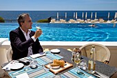France,Alpes Maritimes,Saint Jean Cap Ferrat,Grand-Hotel du Cap Ferrat,a 5 star palace from Four Seasons Hotel,the chic poolside Club Dauphin by the pool and facing the sea