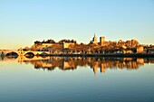 France,Vaucluse,Avignon,Saint Benezet bridge on the Rhone dating from the 12th century with in the background Cathedral of Doms dating from the 12th century and the Papal Palace listed UNESCO World Heritage