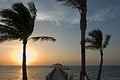 USA,Florida,Florida Keys,Sunrise over pier and boat dock at luxurious Cheeca Lodge,Islamorada